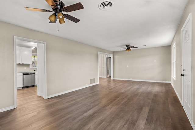 unfurnished living room with wood-type flooring and ceiling fan