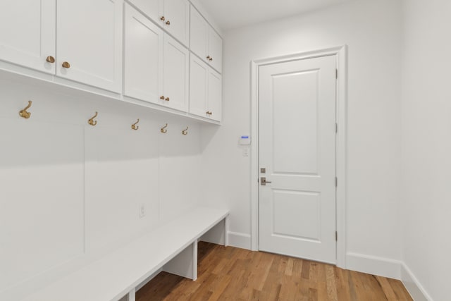 mudroom with light hardwood / wood-style floors