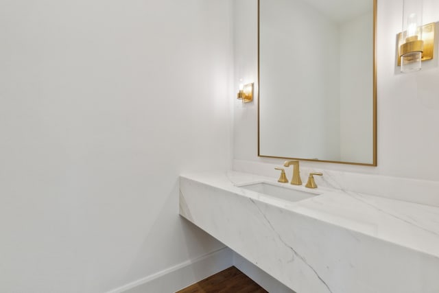 bathroom featuring vanity and hardwood / wood-style floors