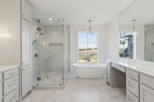 bathroom with separate shower and tub and vanity