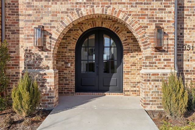 view of exterior entry featuring french doors