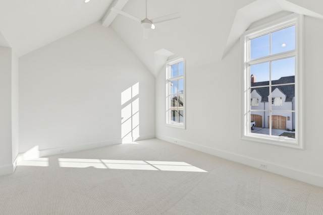 interior space with light carpet, beam ceiling, high vaulted ceiling, and ceiling fan