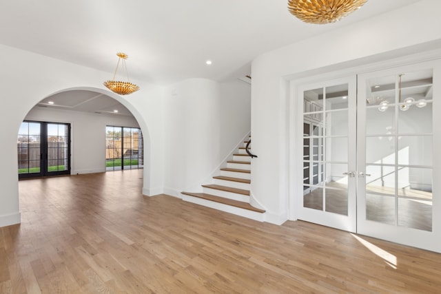 interior space featuring light wood-type flooring and french doors