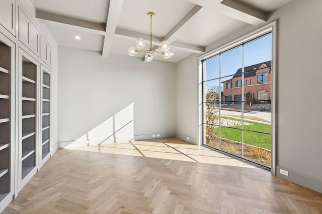 spare room featuring a notable chandelier, built in shelves, beamed ceiling, and light parquet floors