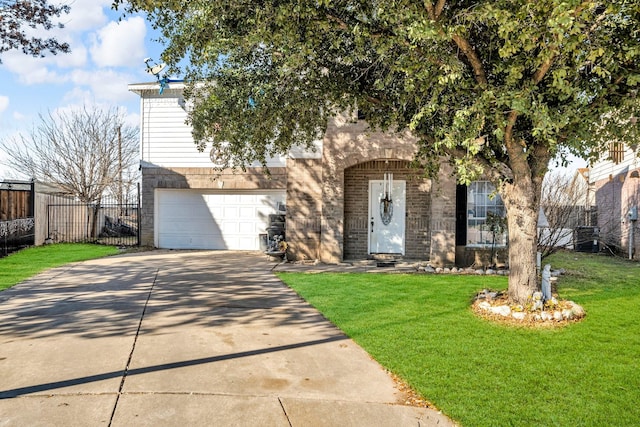 view of front facade with a garage and a front lawn