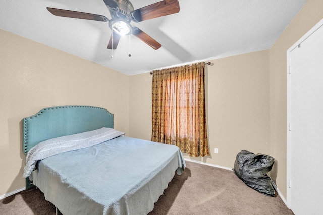 bedroom with ceiling fan and carpet floors