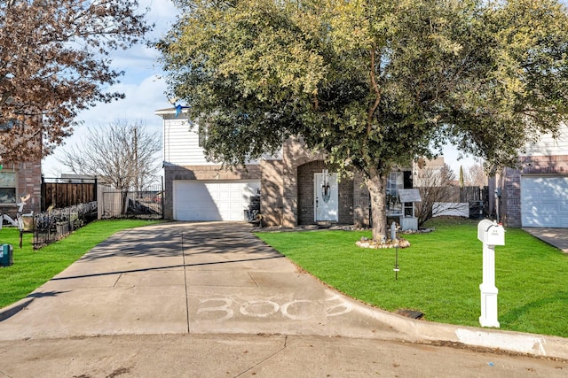 view of front of property with a garage and a front yard