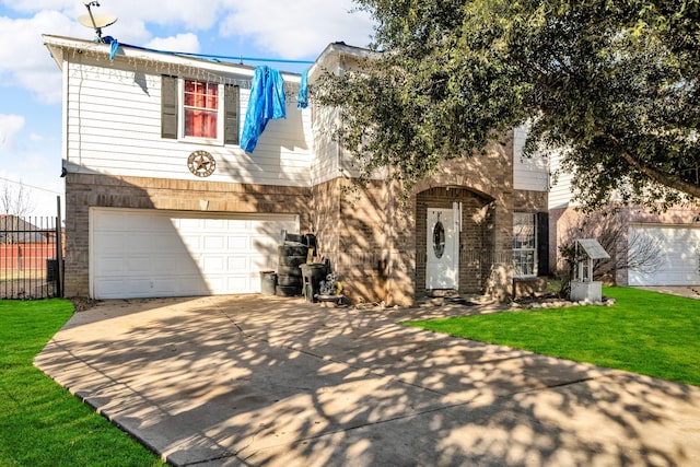 view of front of property with a garage and a front lawn