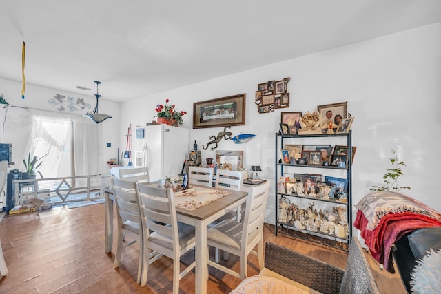 dining area with wood-type flooring