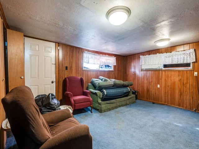 bedroom featuring light colored carpet and a textured ceiling