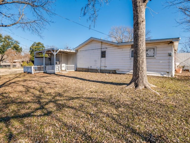 back of house with a yard