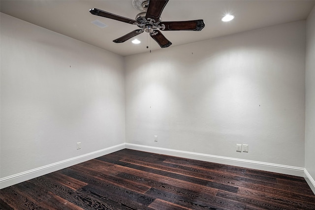 empty room featuring ceiling fan and dark wood-type flooring