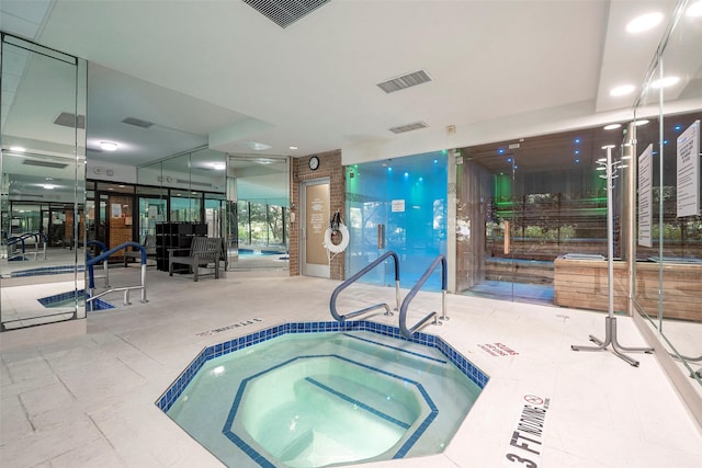 view of pool with an indoor in ground hot tub