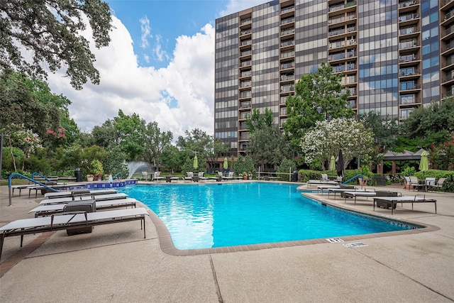 view of swimming pool featuring a patio and a gazebo