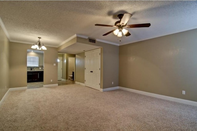 unfurnished living room featuring ceiling fan with notable chandelier, light colored carpet, ornamental molding, and a textured ceiling