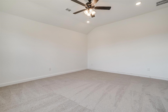 unfurnished room with ceiling fan, light colored carpet, and lofted ceiling