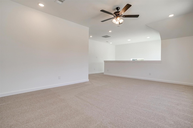 carpeted spare room with ceiling fan