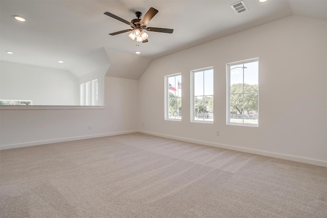 bonus room with light carpet, vaulted ceiling, and ceiling fan