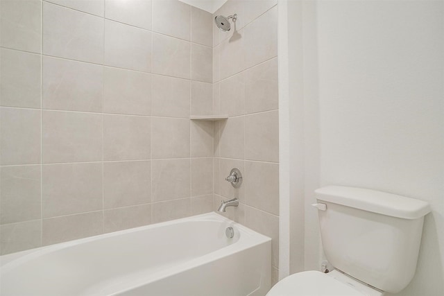 bathroom featuring toilet and tiled shower / bath combo