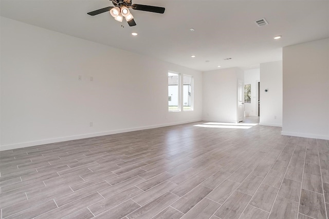 unfurnished room with ceiling fan