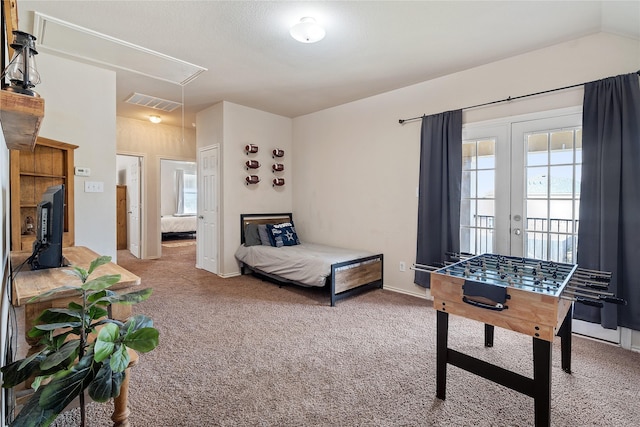 carpeted bedroom with french doors and access to outside