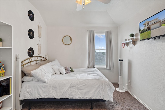 bedroom with ceiling fan, carpet floors, and lofted ceiling