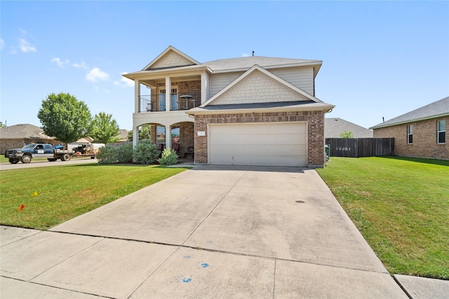 view of front facade with a balcony, a garage, and a front lawn