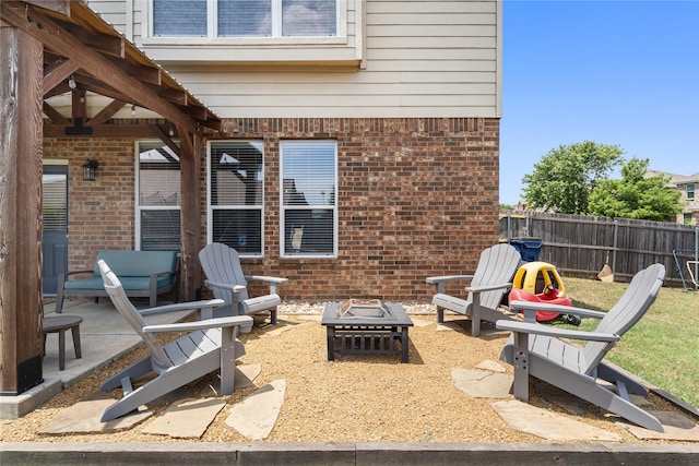 view of patio featuring an outdoor fire pit