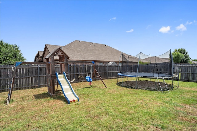 view of playground featuring a trampoline and a yard