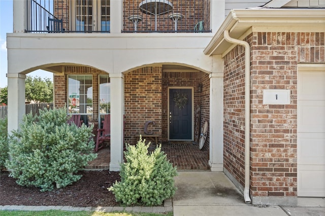 entrance to property with a balcony