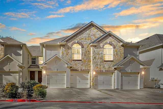 front facade with a garage