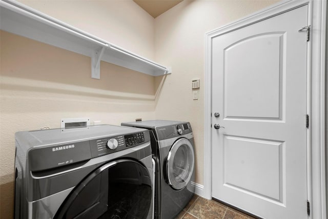 laundry area featuring washing machine and clothes dryer