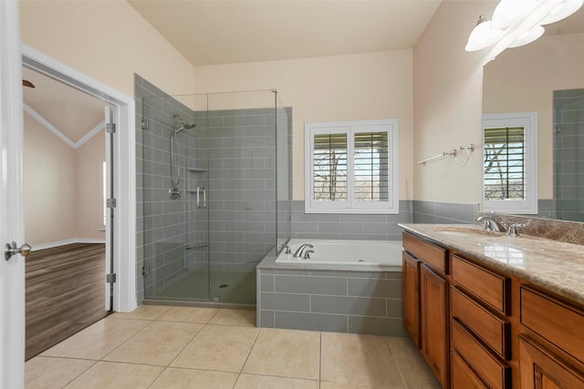 bathroom with crown molding, shower with separate bathtub, tile patterned floors, and vanity