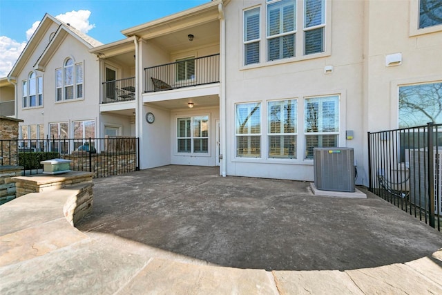 rear view of house with cooling unit