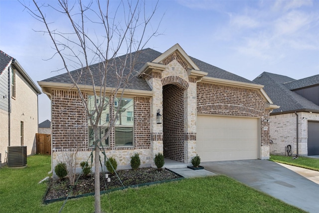 view of front of home featuring a front yard and a garage