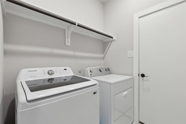 laundry area with washer and clothes dryer