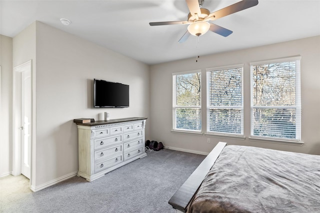 bedroom with multiple windows, carpet floors, and ceiling fan