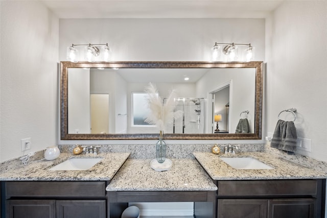 bathroom with vanity and a shower with shower door