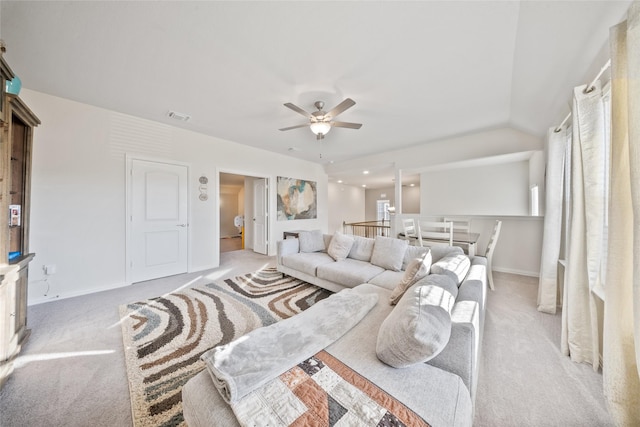 carpeted living room featuring lofted ceiling and ceiling fan