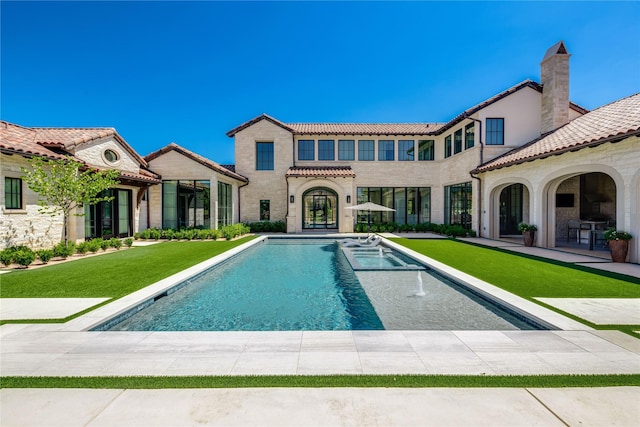 view of pool with a yard