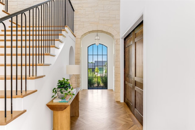 foyer entrance featuring light parquet floors