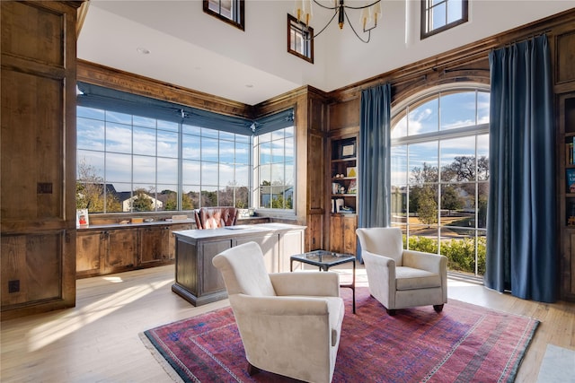 sitting room with an inviting chandelier and light hardwood / wood-style flooring