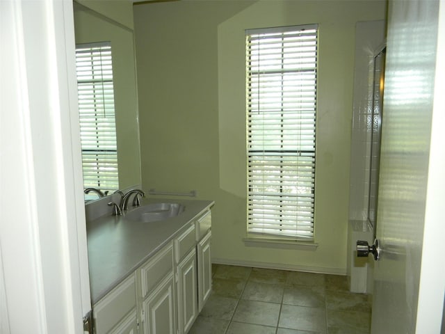 bathroom featuring vanity and tile patterned flooring