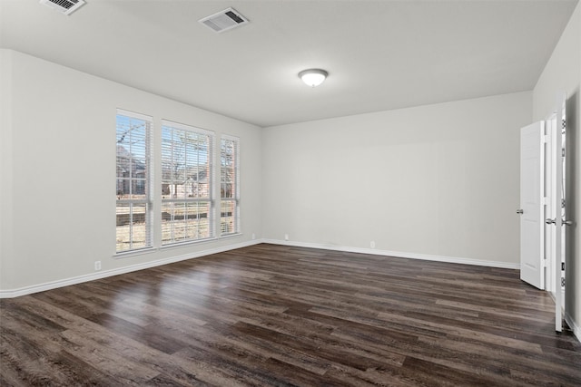 empty room with dark wood-type flooring