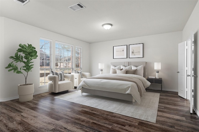 bedroom with dark wood-type flooring