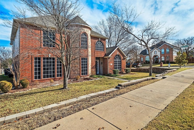 view of front of home featuring a front yard