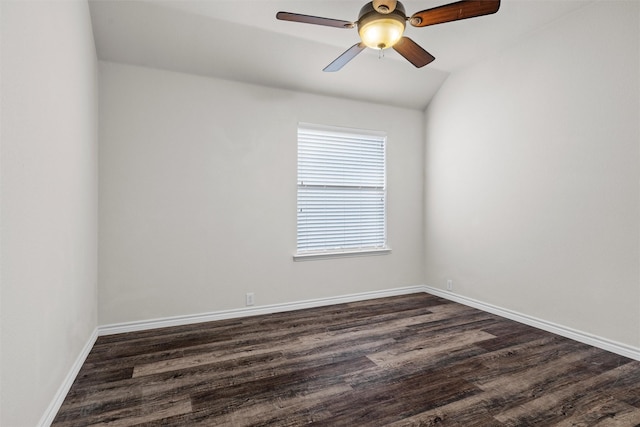 empty room with ceiling fan, dark hardwood / wood-style flooring, and lofted ceiling