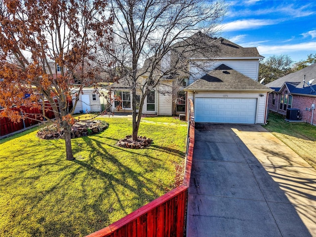 view of front of home with a garage, central air condition unit, and a front yard