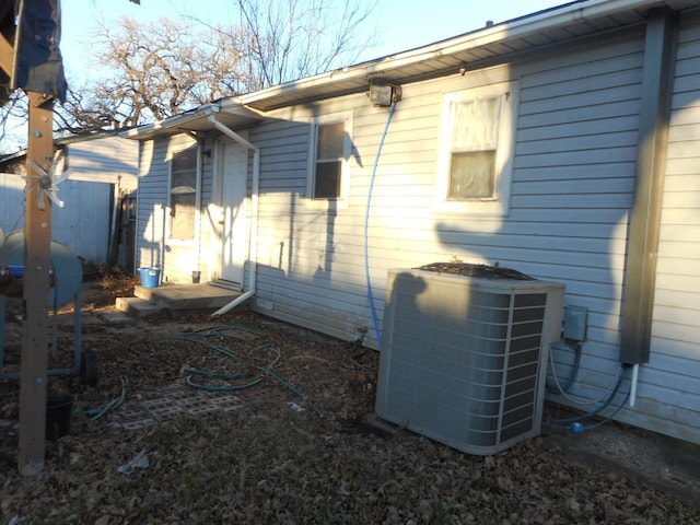 view of side of home with cooling unit