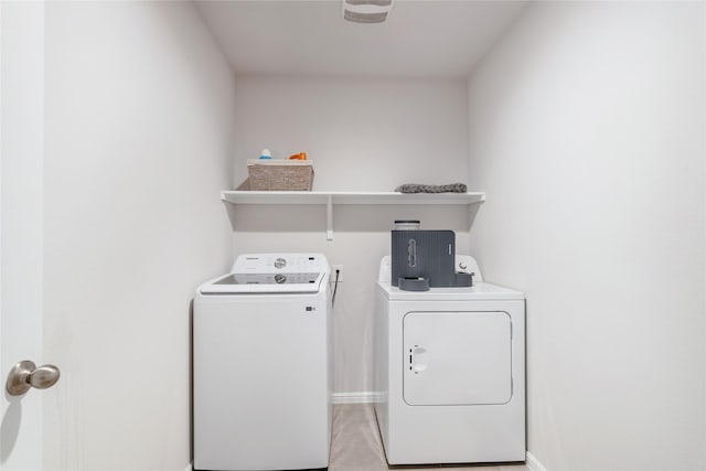 clothes washing area featuring washing machine and dryer